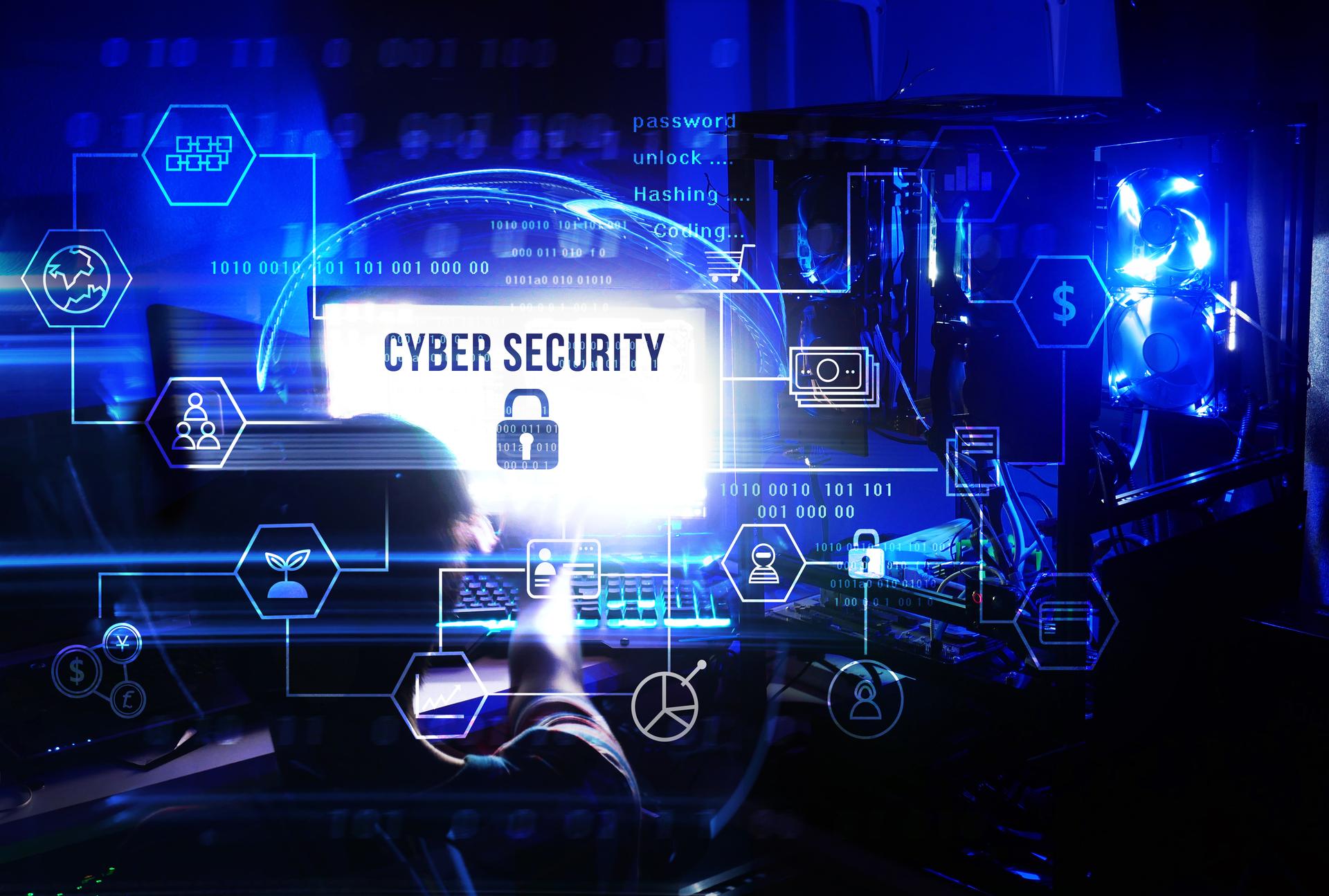 Business, technology, internet and networking concept. Man working on his computer and server, select the icon cyber security on the virtual display diagram.